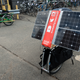 Illustration for article titled This Apocalypse-Ready Solar Charging Station Folds Up Behind a Bike